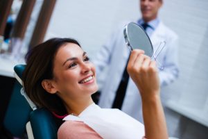 young women looking at her smile 