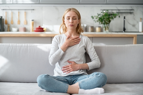woman doing breathing techniques